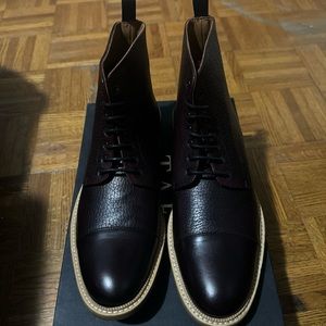 2 brown boots 1 oxblood boot
